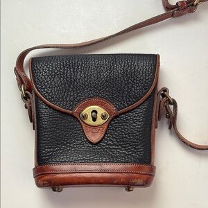 Vintage Dooney & Bourke black leather brown strap and accent mini crossbody